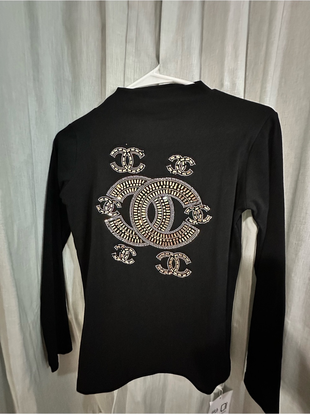 Black Long-Sleeve Women’s Top with Embellished Logo Detail